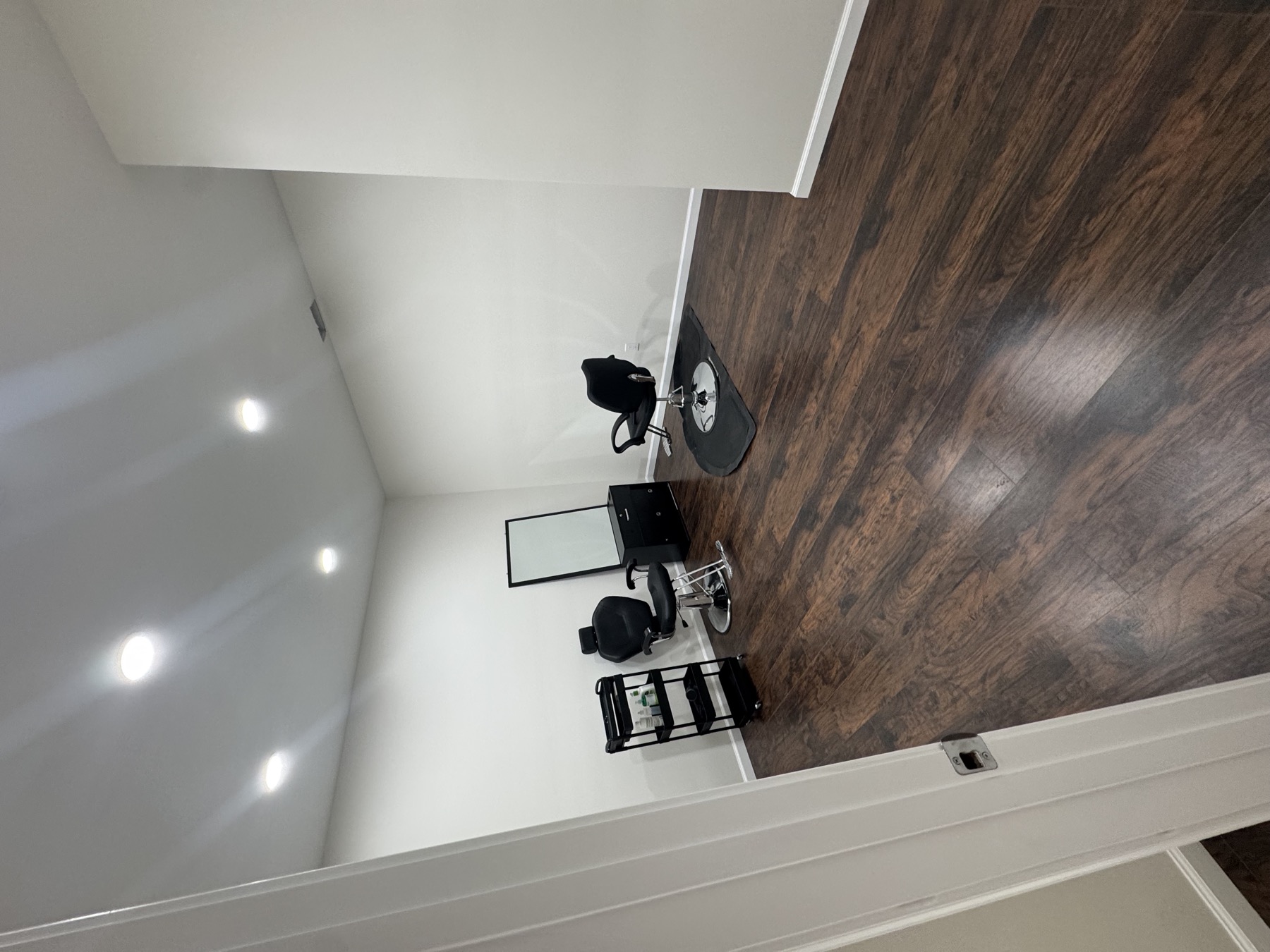 Finished basement styling room with salon chairs