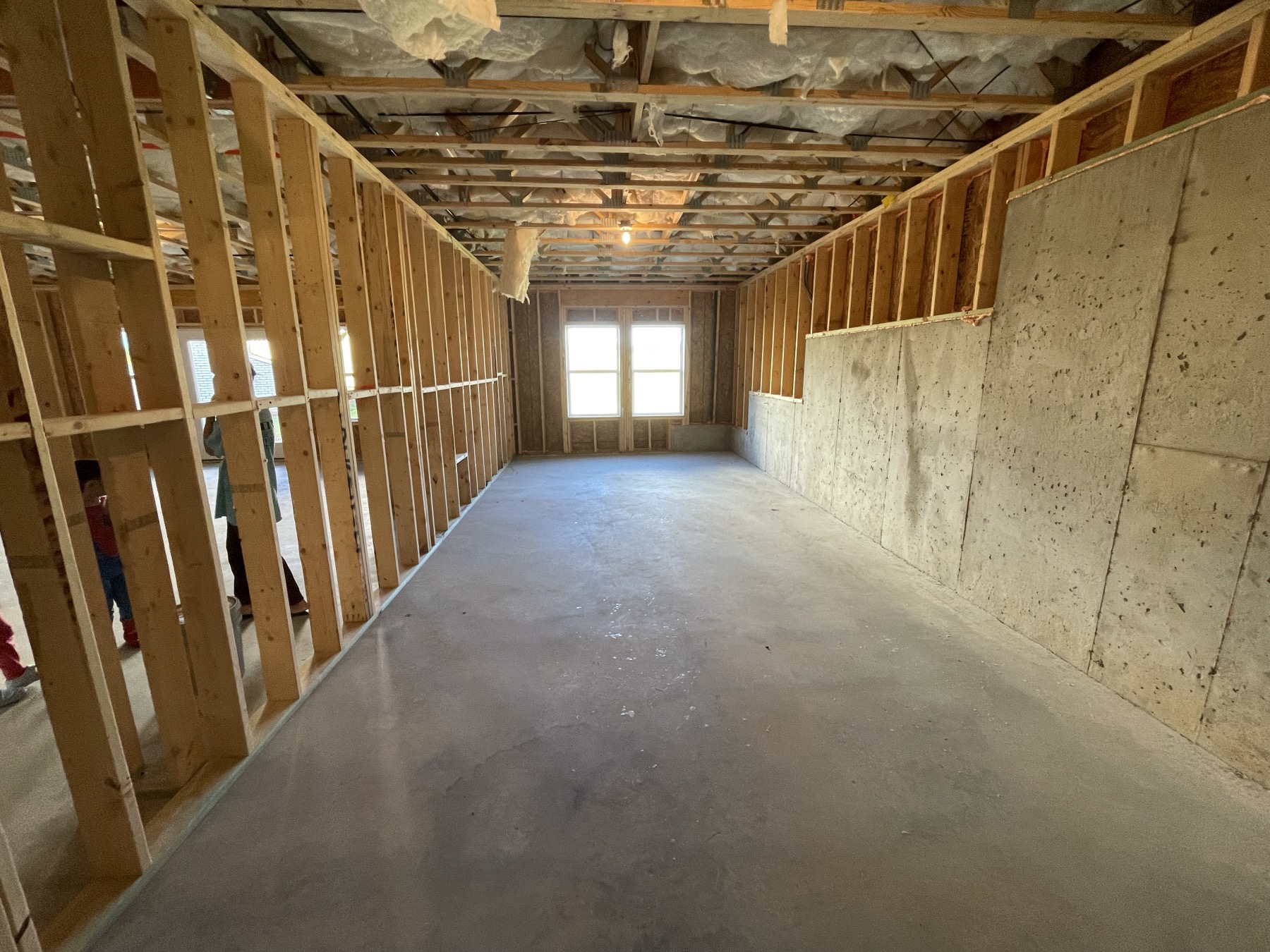 Unfinished basement hallway framing
