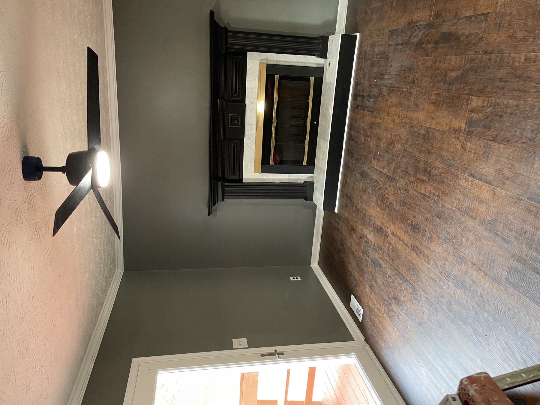 Whole-home renovation featuring a new fireplace and refinished floors