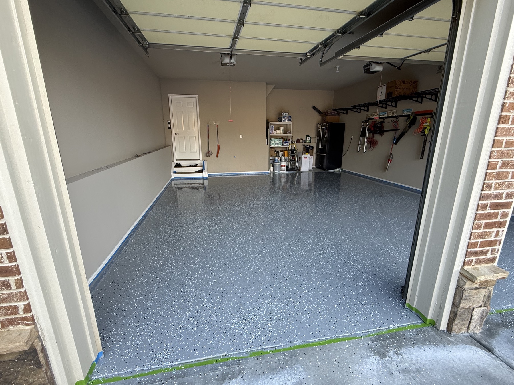 Garage floor finished with gray flake epoxy coating