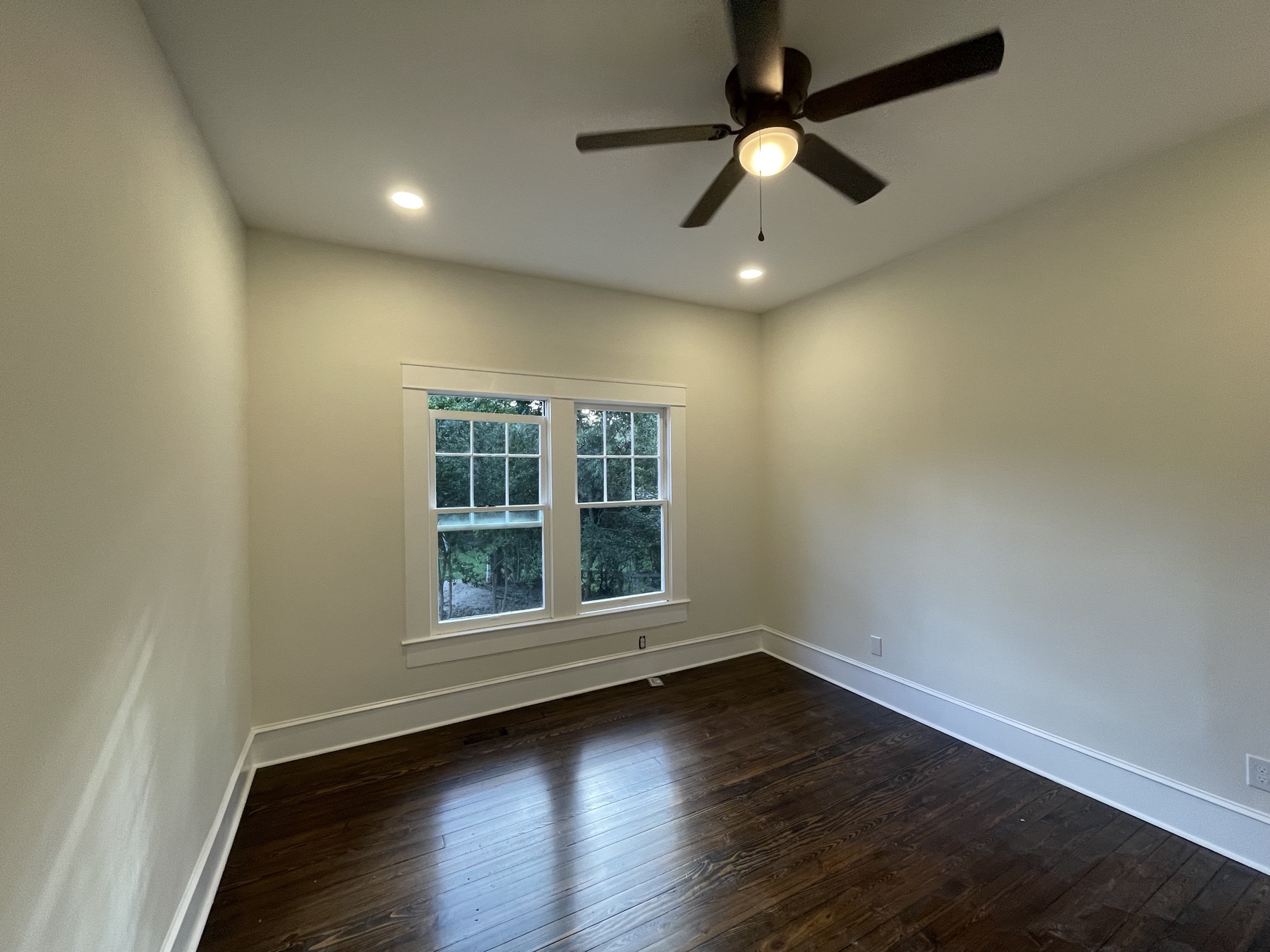 Finished bedroom with double window