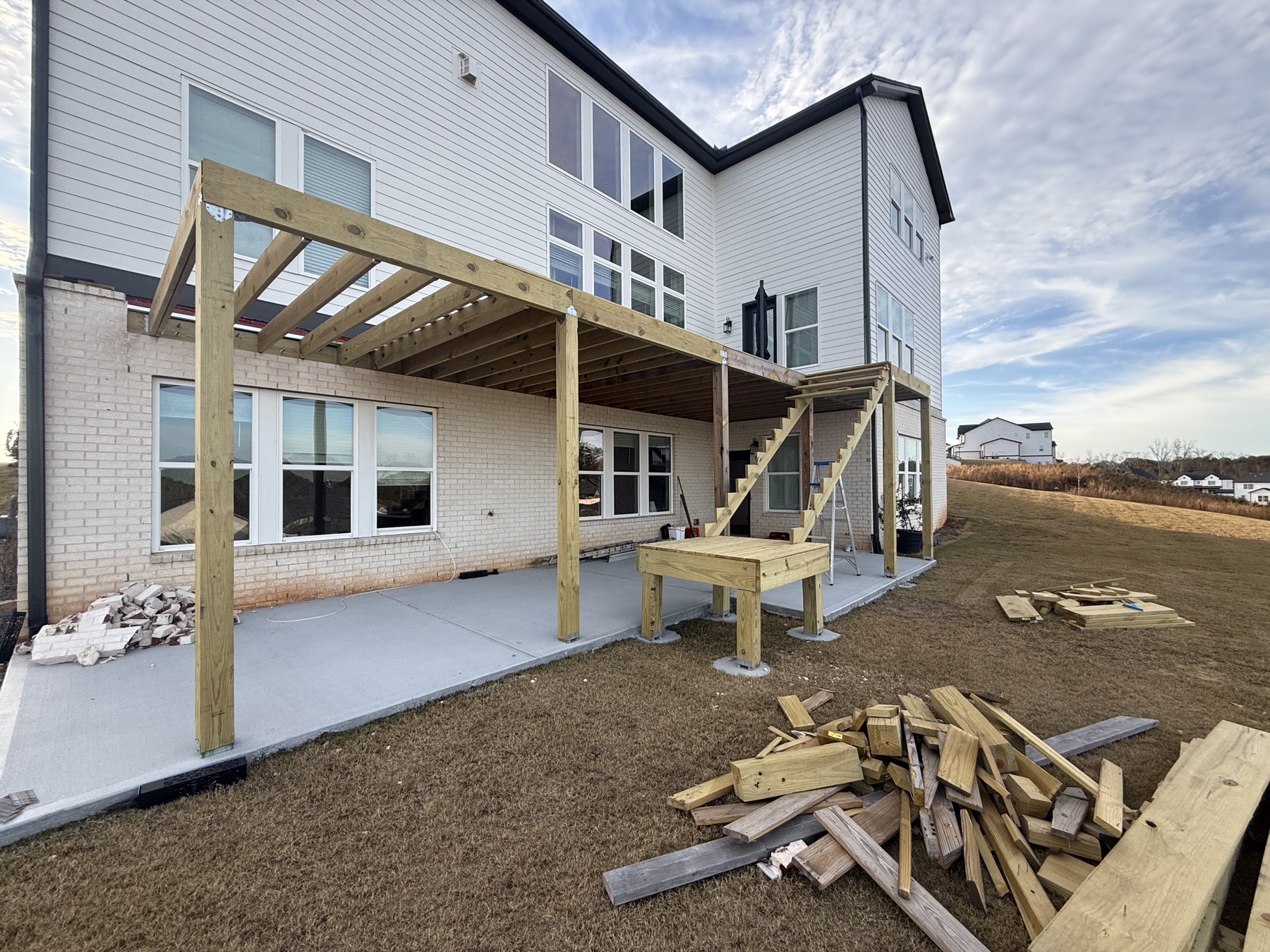 New pergola-covered deck framing under construction